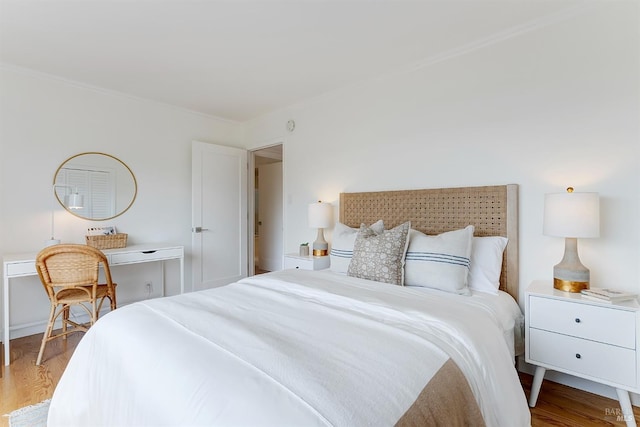 bedroom with wood finished floors