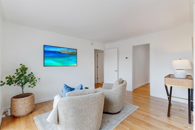 interior space with baseboards and light wood finished floors