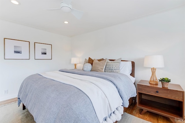 bedroom featuring baseboards, a ceiling fan, light wood-style flooring, and recessed lighting