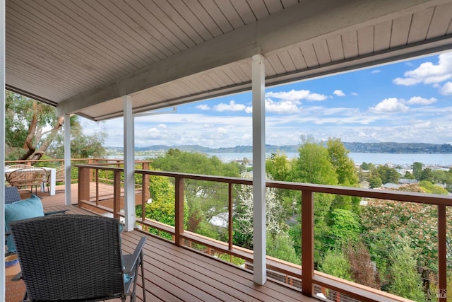 wooden terrace with a water view