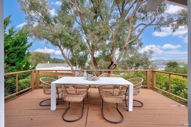 wooden deck with outdoor dining area