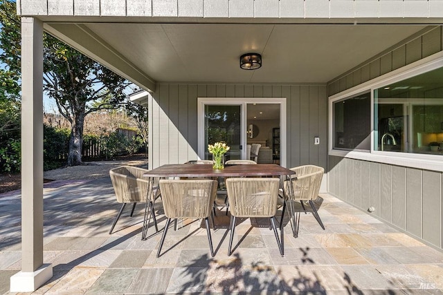 view of patio / terrace with outdoor dining area and fence