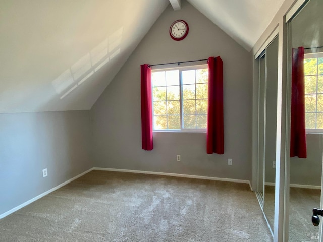 bonus room featuring carpet floors, vaulted ceiling, and baseboards