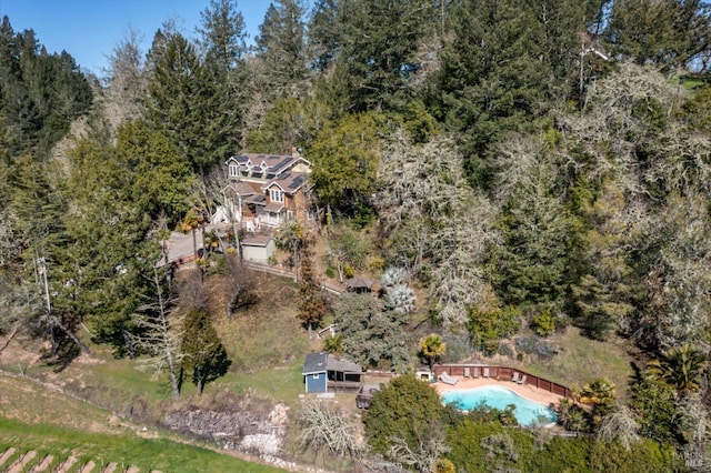 birds eye view of property with a wooded view