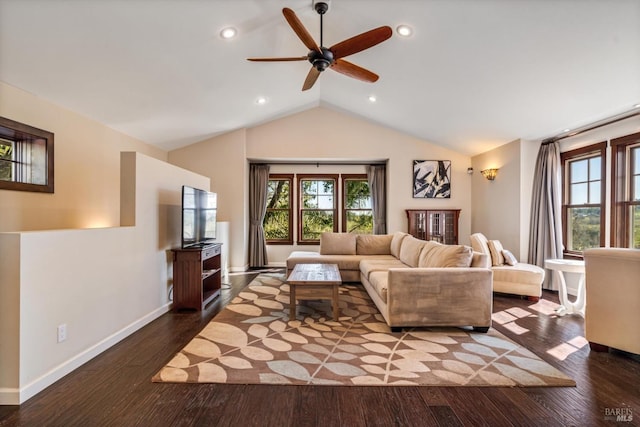 living area featuring vaulted ceiling, wood finished floors, and a wealth of natural light