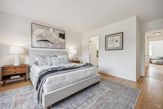 bedroom with wood finished floors