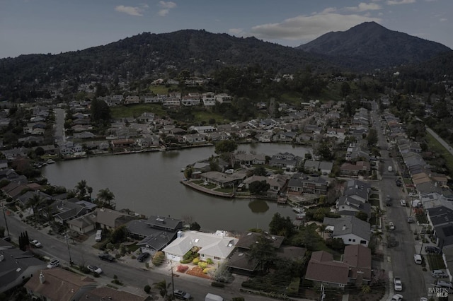 bird's eye view with a residential view and a water and mountain view