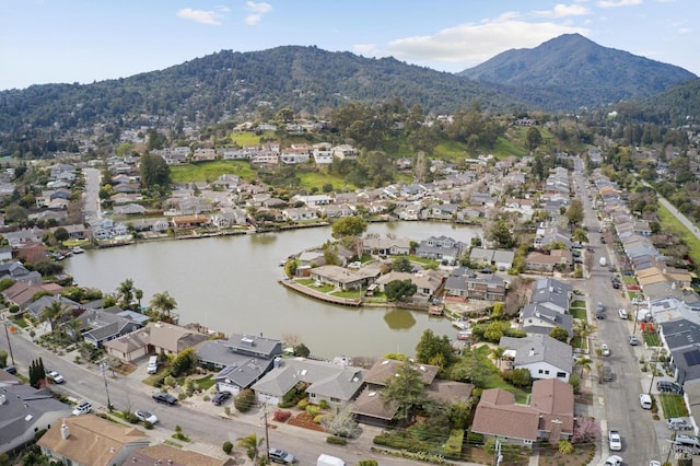 bird's eye view with a residential view and a water and mountain view