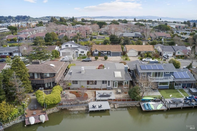 aerial view with a water view and a residential view