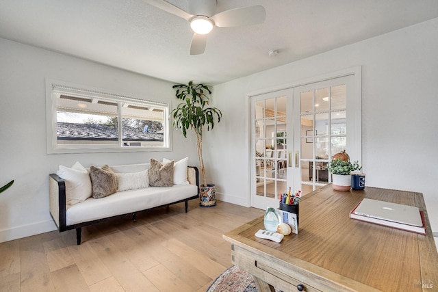 office featuring wood-type flooring, baseboards, ceiling fan, and french doors