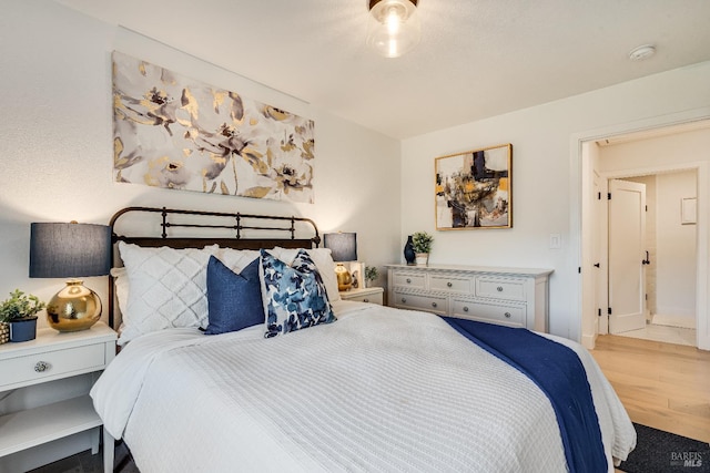 bedroom featuring wood finished floors