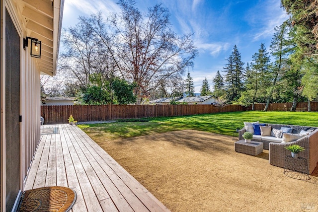 view of yard featuring a wooden deck, a patio, a fenced backyard, and an outdoor living space