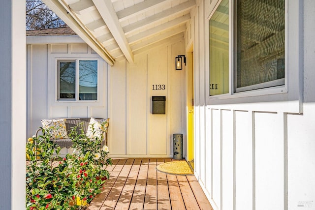 view of exterior entry featuring board and batten siding