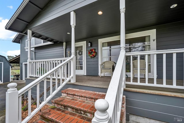 property entrance with covered porch