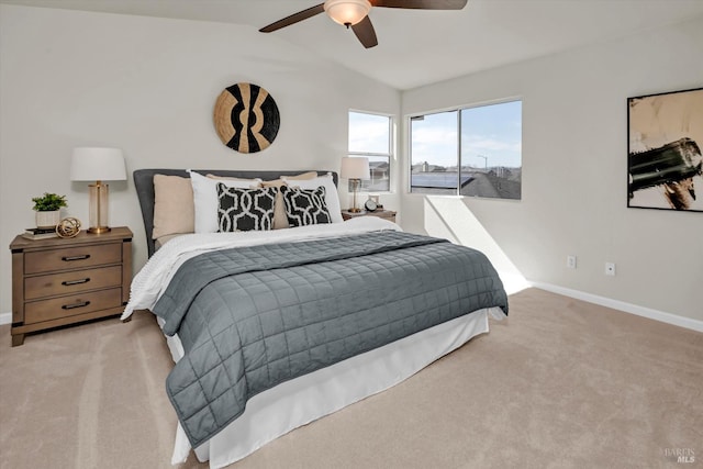 bedroom with carpet floors, baseboards, a ceiling fan, and lofted ceiling