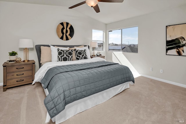 carpeted bedroom featuring baseboards and a ceiling fan