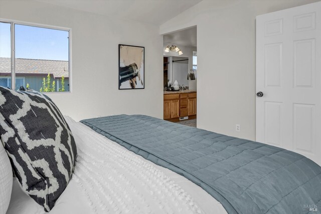 bedroom featuring vaulted ceiling