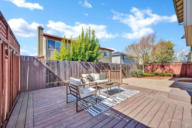 deck featuring an outdoor hangout area and a fenced backyard