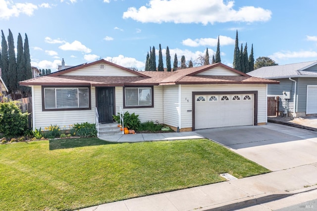 ranch-style house with an attached garage, concrete driveway, and a front yard