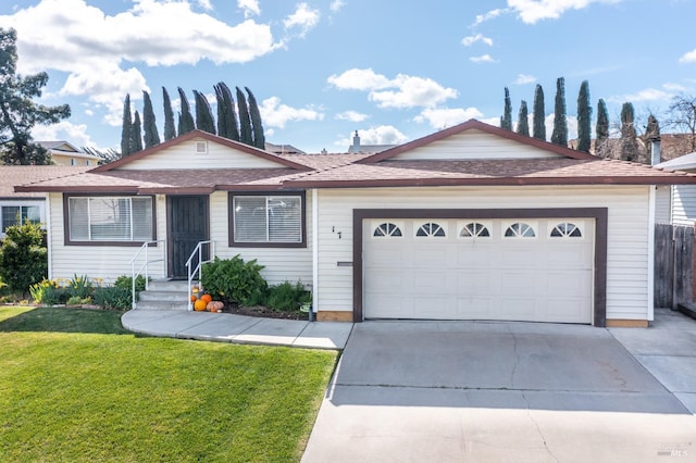 ranch-style home with a shingled roof, an attached garage, driveway, and a front lawn