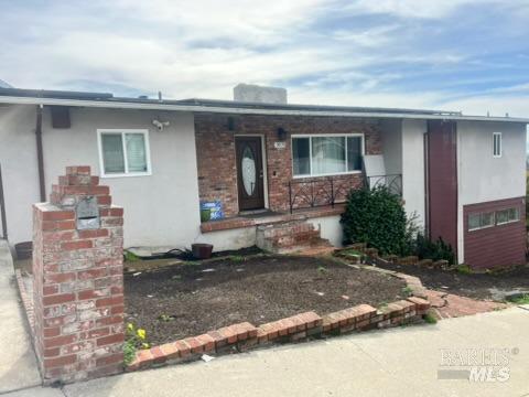 view of front of home featuring brick siding