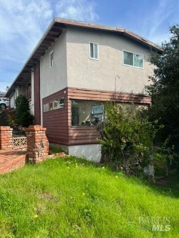 back of property with stucco siding