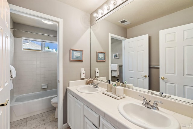 full bath featuring tile patterned floors, a sink, toilet, and visible vents