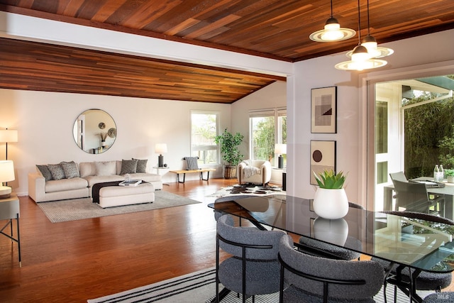 dining area featuring a notable chandelier, wood ceiling, vaulted ceiling, and wood finished floors