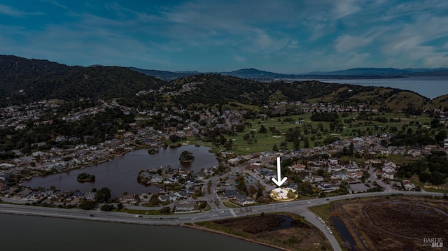 aerial view featuring a water and mountain view