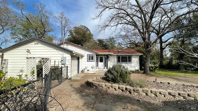 ranch-style house featuring driveway and a garage