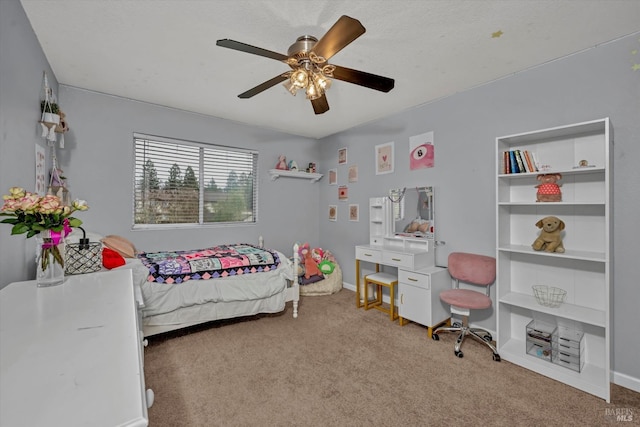 carpeted bedroom with baseboards and ceiling fan