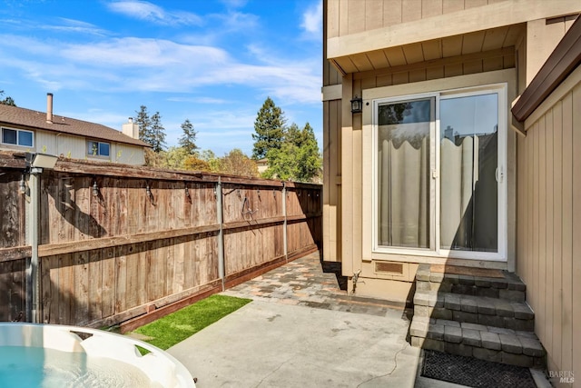 view of patio / terrace featuring a fenced backyard and entry steps