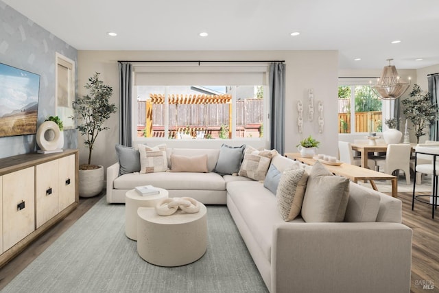 living area with recessed lighting and wood finished floors