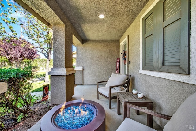 view of patio featuring a fire pit