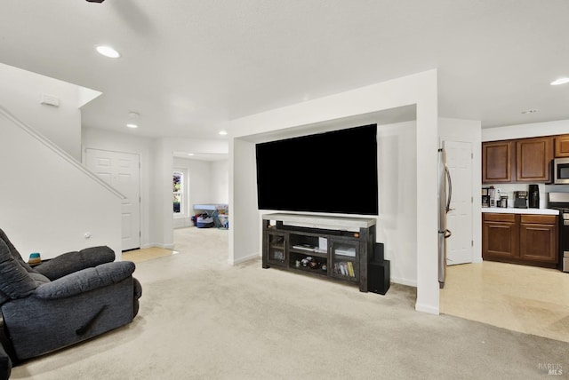 living room featuring baseboards, recessed lighting, and light colored carpet