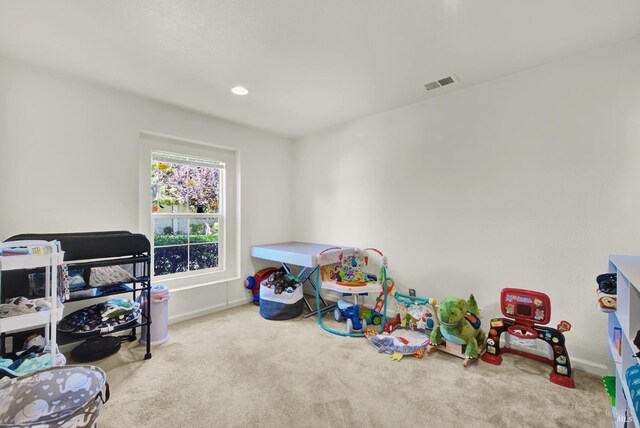 game room with carpet, visible vents, and baseboards