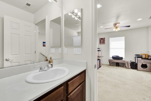 bathroom featuring a ceiling fan, recessed lighting, visible vents, and vanity