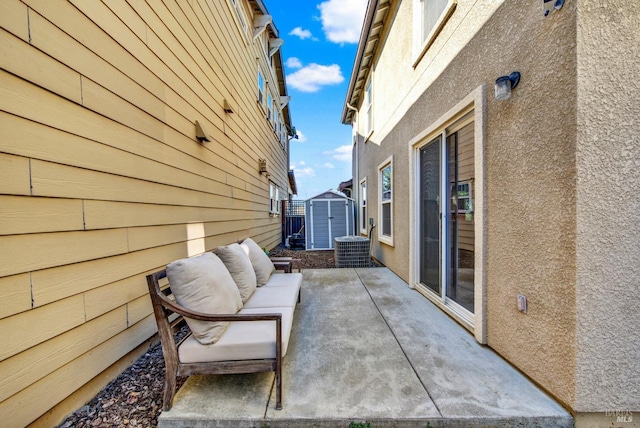 view of patio featuring a storage shed, an outdoor hangout area, and an outbuilding