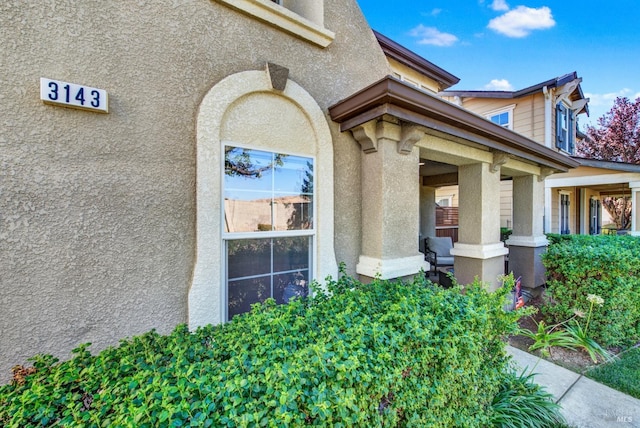 doorway to property with stucco siding