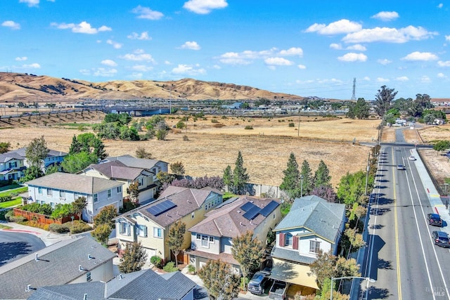 birds eye view of property with a residential view and a mountain view