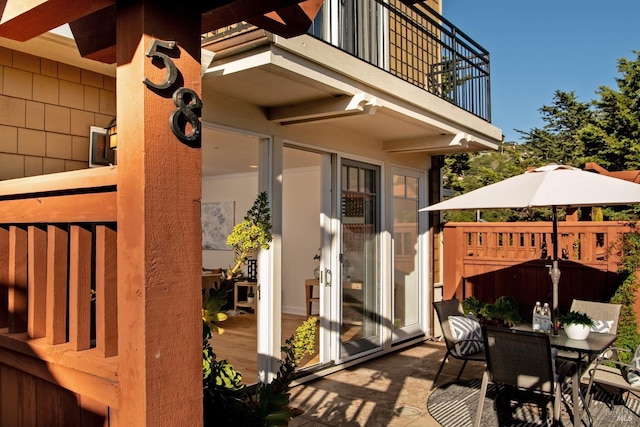 view of patio / terrace featuring outdoor dining area and a balcony