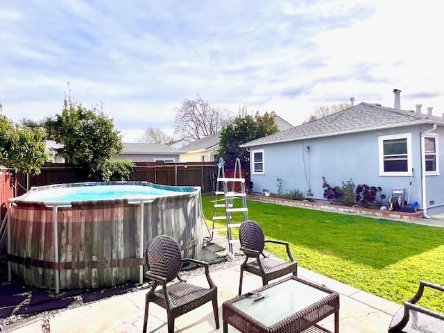 view of patio with fence and a fenced in pool