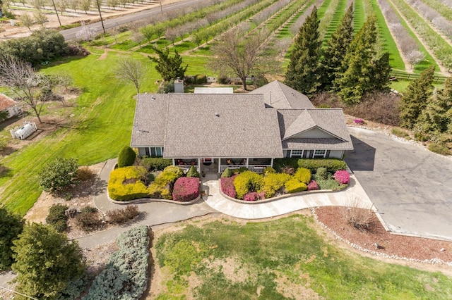 birds eye view of property with a rural view