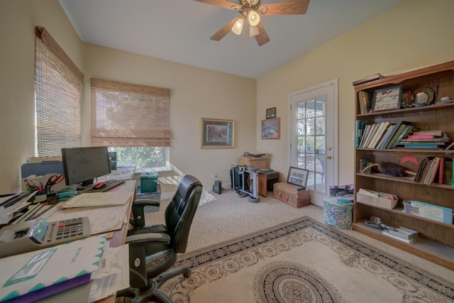 carpeted office space featuring a wealth of natural light and a ceiling fan