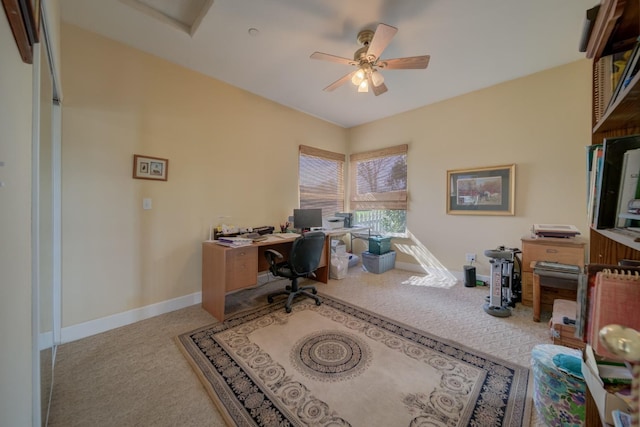 home office with baseboards, carpet floors, and a ceiling fan