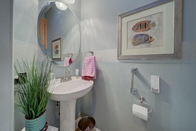 bathroom with a textured wall