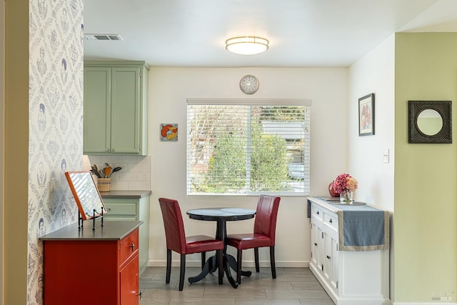 dining room with visible vents and baseboards