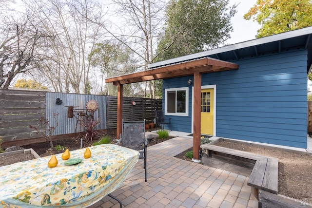 view of patio with outdoor dining area and a fenced backyard