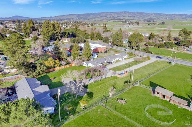 birds eye view of property featuring a residential view, a mountain view, and a rural view