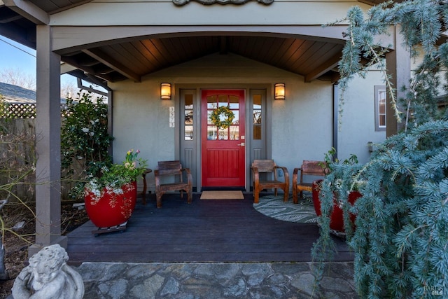 view of exterior entry with stucco siding